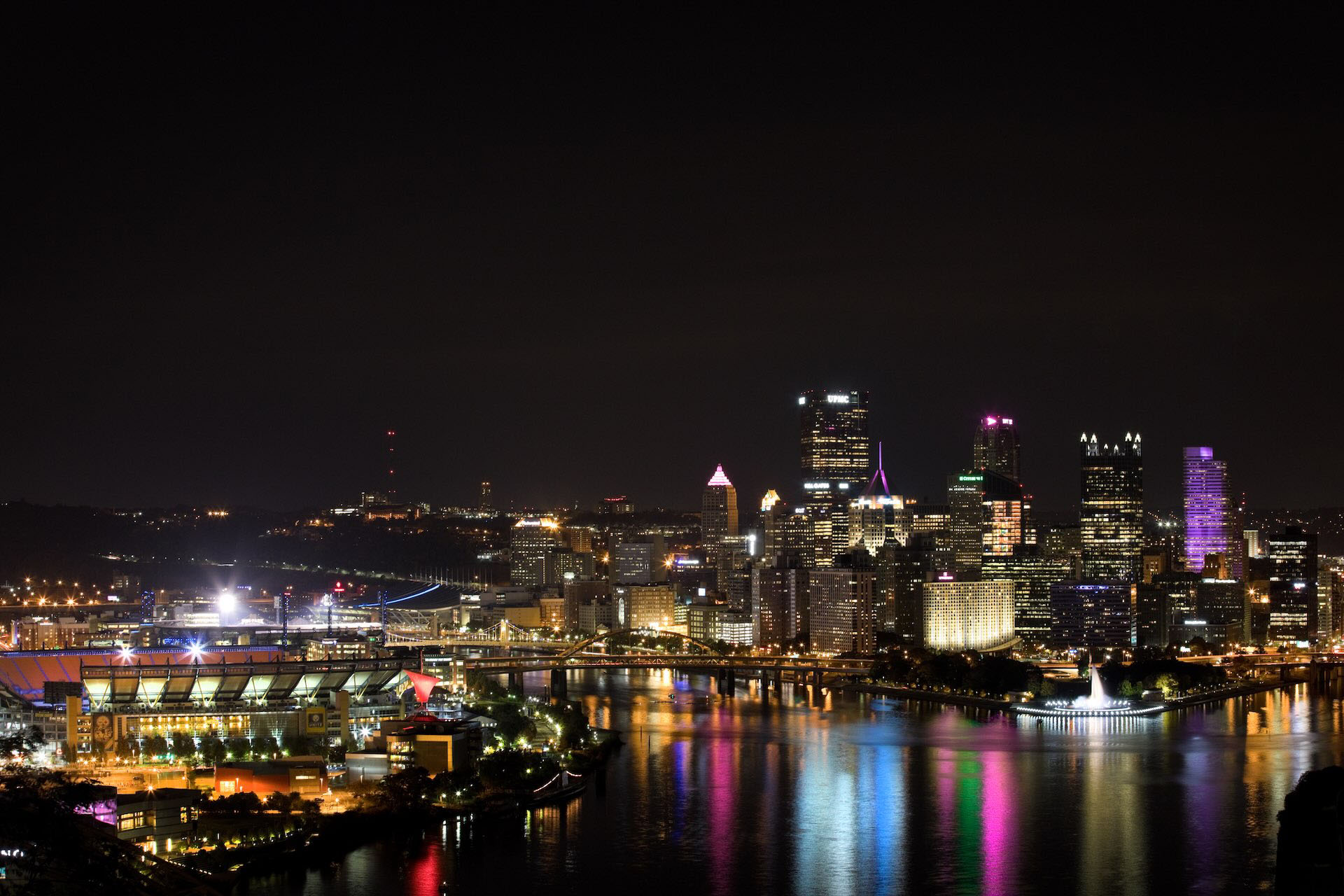 View of Acrisure Stadium and Pittsburgh at night